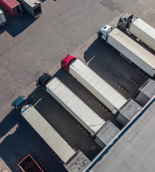 trucks-unloading-in-logostics-hub-2025-01-08-23-40-18-utc trucks-unloading-in-logostics-hub-2025-01-08-23-40-18-utc